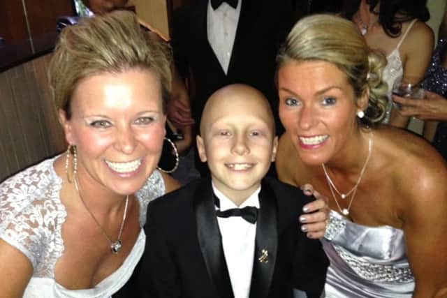 Ethan is pictured with his godmother, Dawn Foulston and his mum, Sam Maull