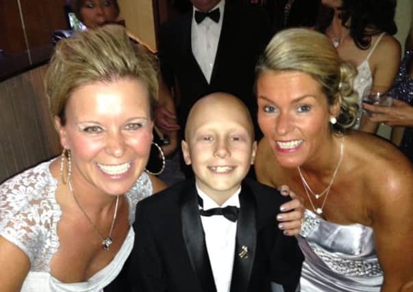 Ethan is pictured with his godmother, Dawn Foulston and his mum, Sam Maull