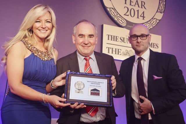 Auction House Founding Director Roger Lake (centre) receiving Sliver Award for Best Franchise from Michelle Mone (Founder of Ultimo) and Ben Greco (MovewithUs Group)