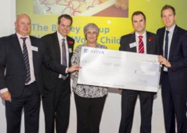 Janet Marshall, a volunteer at the hospice, attends the cheque presentation evening in London