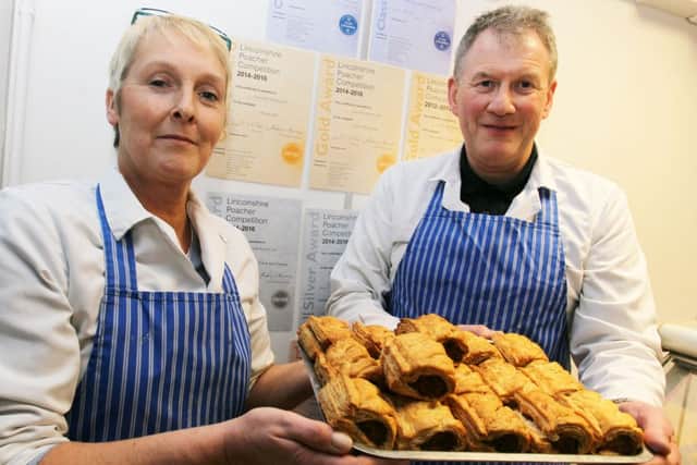 Tony Arber butchers in Scotter have won several awards at the Lincolnshire Poacher Competition. Pictured are Susan Jones and Tony Arber.