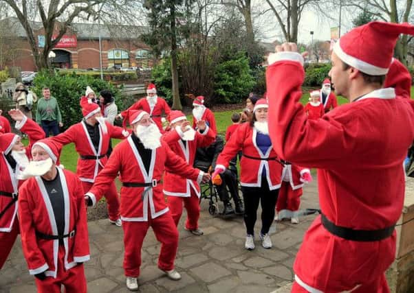 Santa Dash in aid of Aurora Well being at Worksop. Santa, Warm up session for the Santa's (5 & 6)