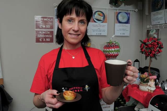 Sisters Diner owner Maggie Kopanska with the Danish Pastry & Tea or Coffee, available free this week.  Sisters Diner is at 52 Gateford road, Worksop.NWGU 15-12-14 Danish,  Sisters Diner owner Maggie Kopanska, pictured with the Free Danish pastry & Tea or coffee  ( 1 & 2).