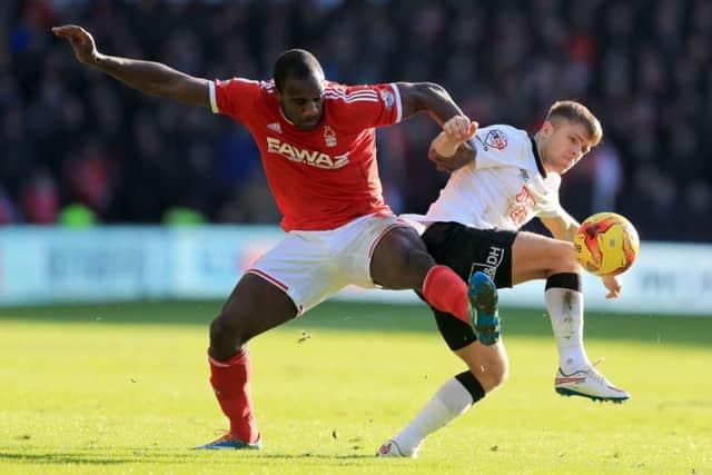 Nottingham Forest's Michail Antonio (left) and Derby County's Jamie Ward (right) battle for the ball during the Sky Bet Championship match at the iPro Stadium, Derby. PRESS ASSOCIATION Photo. Picture date: Saturday January 17, 2015. See PA story SOCCER Derby. Picture credit should read: Mike Egerton/PA Wire. RESTRICTIONS: Editorial use only. Maximum 45 images during a match. No video emulation or promotion as 'live'. No use in games, competitions, merchandise, betting or single club/player services. No use with unofficial audio, video, data, fixtures or club/league logos.