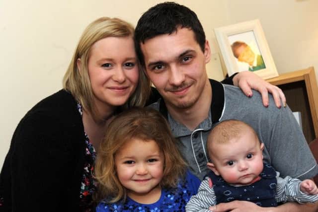 Katy Jordan and Ryan Seeley with their children Poppy and Felix who escaped a house fire at their Rhodesia home.