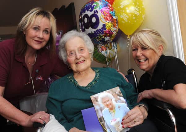 Fay Jones, of Waterside Grange Care Home, Dinnington is celebrating her 100th birthday, with Lizzie Rennocks (l), Senior Activity Co-ordinator and Maureen Veveris, care assistant. Picture: Andrew Roe