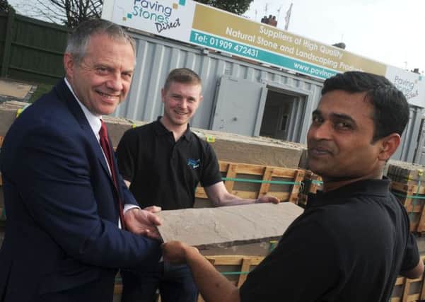 Ajay Adla, right, and Tom Raisbeck, the co-owners of Paving Stones Direct share their business success story with Bassetlaw MP John Mann when he visited their Turner Road yard on Friday.