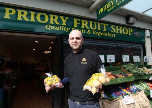 Worksop Guardian reader offer of a free bag of potatoes at Priory Fruit Shop in the Priory Shopping Centre. Pictured is Phil Taylor with the offer.