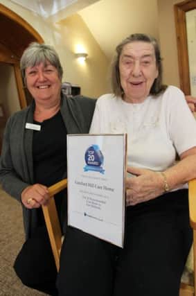 Gateford Hill Care Home in Worksop has just received an award for being in the top 20 best care homes in the East Midlands. Pictured are Home Manager Helen Hopkinson, and resident Mary Elmer.