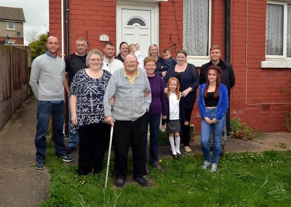 Celebrating the safe return of Les (Golly) Cluroe, pictured are some of the friends and family who were out looking for him