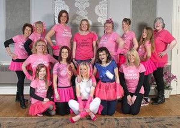 The Cancer Fighters with Amelia Bailey pictured front centre.  Three of the ladies wearing body paint to highlight the fight against cancer and the impact it has on lives.
