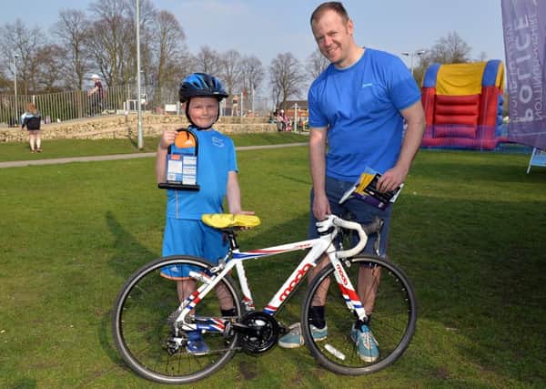 Free bike MOT and anti theft marking with the Police and Fire Service at The Canch, pictured is Kiegan Wright, seven with Dad Steve