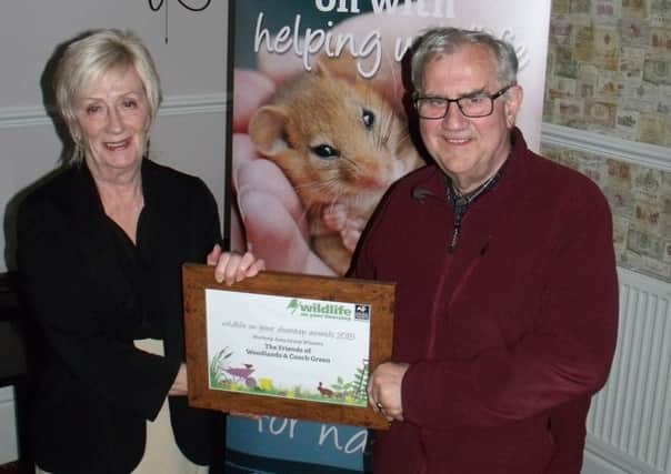 Fran Walker, from Notts Wildlife Trust, presents a Wildlife On Your Doorstep Award to John Palmer of the Friends of Woodlands & Coachwood Green group in Shireoaks