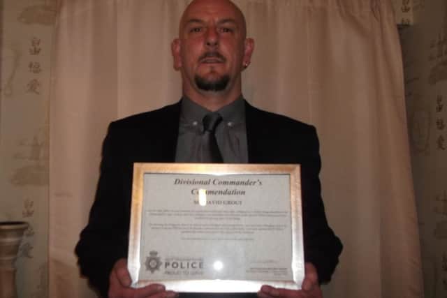Argos security guard David Grout with his Divisional Commander Award