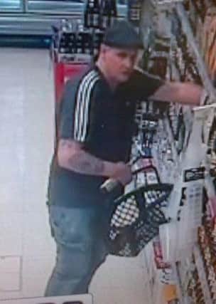 Police seek this man in connection with the theft of two bottles of Cognac.