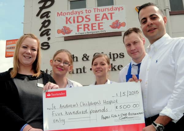 Papa's Fish & Chip Restaurant in Gainsborough, have raised £500 for 
Lincolnshire's 'St Andrews Chidrens Hospice'.
The cash was raised with a Fish & Chip supper fundraiser, held in Papa's restaurant.  The Hospice also looks after children from the Gainsborough area.

NGAS 1-5-15 Papa's;  L/R, Lauren Alexander (Hospice Fundraiser),
Tiff Farrant (Manager), Bianca Colley, Gavin Cowan (Manager), Andrew
Papadamou (Owner). ( to 4)