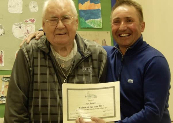 Sid Burgess receives his Misterton Citizen of the Year Award from Coun Wayne Howe