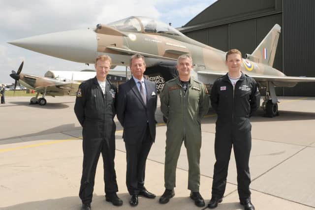 RAF unveils VC 'Battle of Britain' Tyhoon fighter jet in a Battle of Britain era pain scheme to commemorate the 75th anniversary of Battle of Britain. It was also painted with the 249 squadron ID number of the only Fighter Command pilot awarded with a Victoria Cross, Flight Lieutenant James Brindley Nicolson VC DFC. L-R Flight Lieutenant Antony Parkinson MBE, Jim Nicolson - relative of James Brindley-NicolsonBrindley-Nicholson, Wing Commander James Heald, Flight Lieutenant Ben Westoby-Brooks.