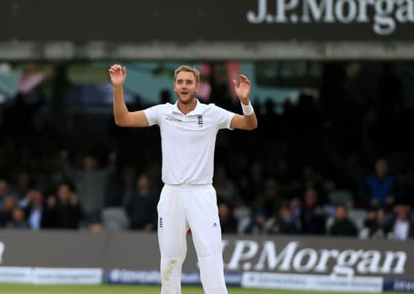 England's Stuart Broad celebrates as New Zealand's Trent Boult is caught by Moeen Ali.