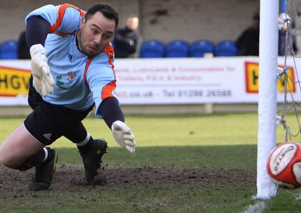 Buxton FC v Worksop, Worksop keeper Jon Kennedy watches a shot just miss his goal