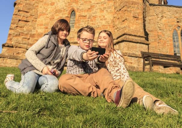 Ella (12), Harry (11) and Natasha (10) get snapping for the West Lindsey Photo Competition 2015 up at the Ramblers Church, Walesby.
