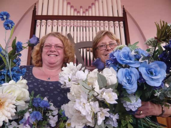 Helen Pritchard (left) and Andrea Powell get set to decorate Apperknowle chapel for the Feast of Flowers.