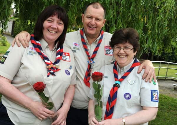 Elaine and Andy Neal with Terrisa Hardingham, right, who received their Guardian Rose at the 26th Worksop Scouts.