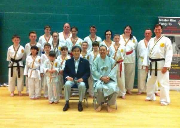 Students from the Lynx Academy in Retford with MasterKim Yong Ho and Master Kim Sang Tae