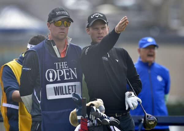 England's Danny Willett discusses a tee shot with his caddie during day two of The Open Championship 2015 at St Andrews, Fife. (Picture: Owen Humphreys/PA Wire).