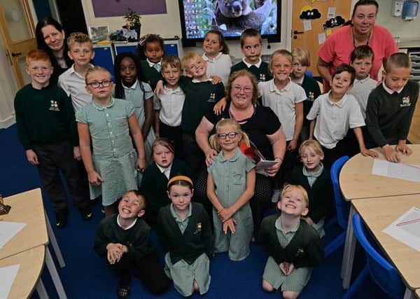 Guardian Rose presentation to Sparken Hill Academy teacher Ann Naylor, Ann is pictured with her class