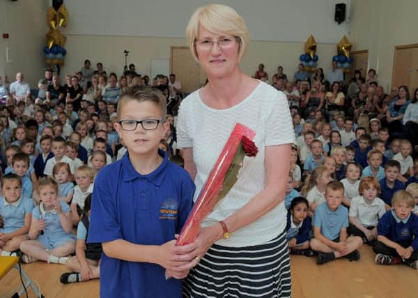 Josh Turner (11),  surprised his 'One to One' support teacher Dawn Harrison, with the presentation of a Guardian Rose..
The Rose handover took place at Josh's school 'Norbridge Academy, Worksop.
Dawn has looked after Josh at the school, since he was three years old.
Both are leaving Norbridge at the end of term.

NWGU 16-7-15 Dawns Rose,  Dawn Harrison receiving her Guardian Rose from 11 year old Josh Turner, at Norbridge school   ( 1 to 4)