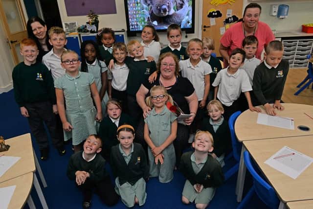 Guardian Rose presentation to Sparken Hill Academy teacher Ann Naylor, Ann is pictured with her class