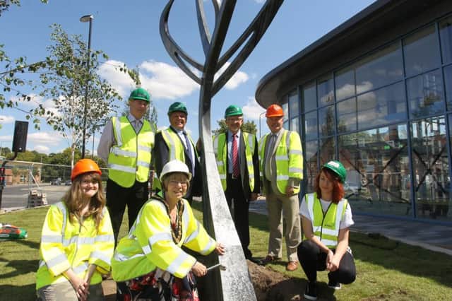 A new sculpture has been unveiled at Worksop bus station which has been designed by students from North Notts College. Students Melaine Walker and Kimberley Moore are pictured with the Chairman of Nottinghamshire County Council Sybil Fielding, and local councillors.