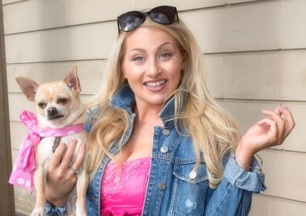 Abi Weigold, who stars as Elle Woods in STOS' Legally Blonde - The Musical, with a four-legged friend hoping to be in the show. Picture: Mark Feakins