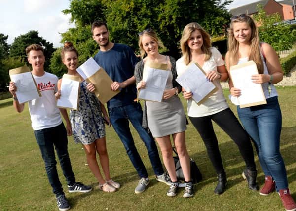 Students at Queen Elizabeth's High School with their A-level results