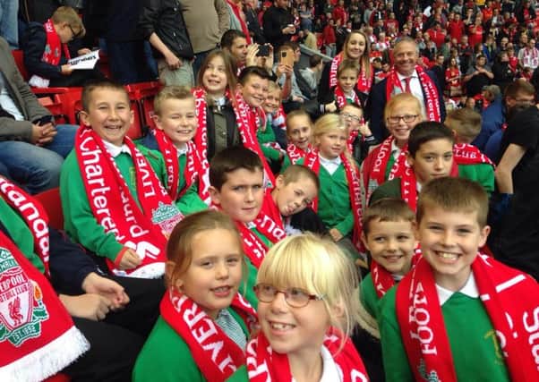 Haggonfields pupils in the stands at Anfield with John Mann MP ready to enjoy Liverpools game against Norwich City
