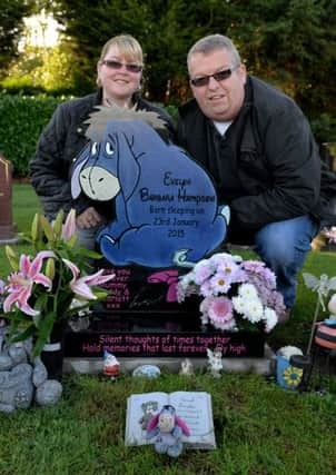 Keith and Emma Hampson with their Daughters headstone which was originally rejected by the council