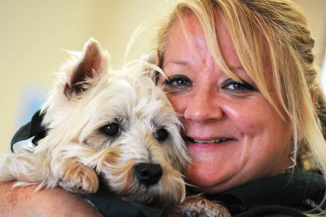 Jerry Green dog rescue centre feature.
Volunteer, Gill Skinner, with Oscar, the Westie that she has adopted.
