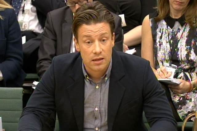 Celebrity chef Jamie Oliver answers questions in front of the Health Select Committee at the House of Commons, London in the subject of Child Obesity Pic: PA Wire