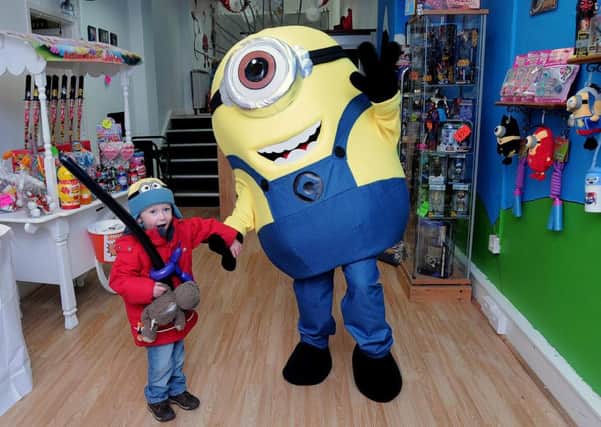 Launch of the 'Action Heroes Parties' shop on Bridge street, Worksop  Ronnie Herd (3) with a minion