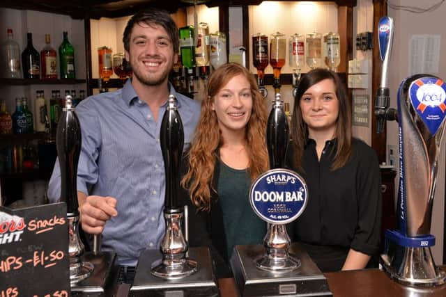 The Swan Inn, Castle Street, Worksop is under new management who have refurbished the pub, pictured are from left Elizabeth Fenn, Harry Taylor and bar staff Drew Williamson