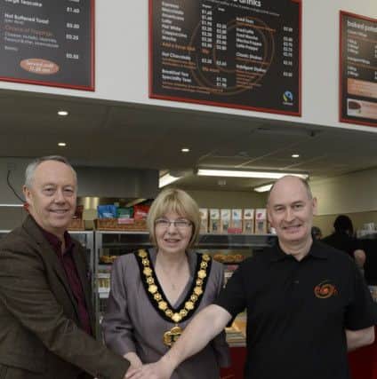 Nosh director Steve Batty with Nottinghamshire County Council chairman Sybil Fielding and franchisee Phil McCall officially open the new Nosh cafe at Worksop bus station