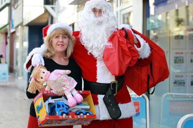 The launch of the annual David Hawkes toy appeal for 2015 in Worksop. Val Casey and Santa at the launch.