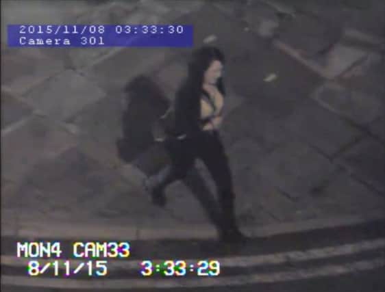 Police would like to speak with this woman in connection with an assault and theft in Mansfield town centre