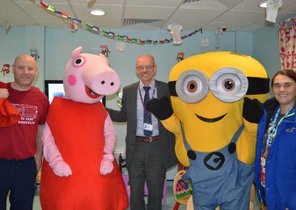 Pictured: Tony Mcmanus; Peppa Pig; Mike Pinkerton, chief executive; Minion and Adele Mumby