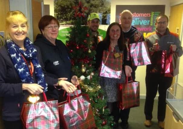 Veolia staff with British Legion fund-raiser Elaine Hopkins (second left) and donated presents