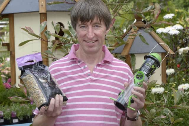 Peter Burks from online garden centre Potter and Rest with some of their bird feeding products