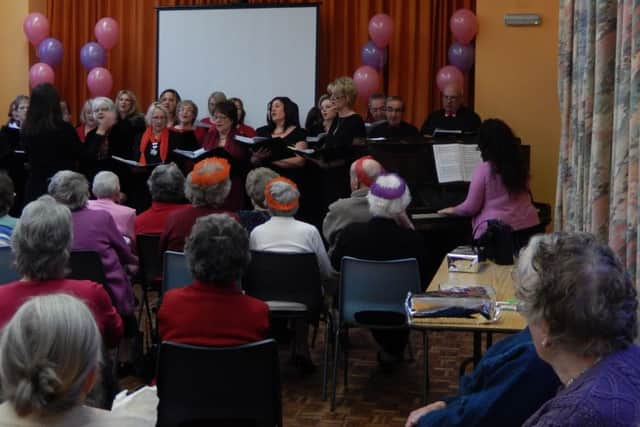 Guests are entertained by the choir at the annual Misterton senior citizens party