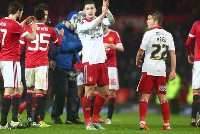 Paul Coutts applauds the Sheffield United fans after the game at Old Trafford