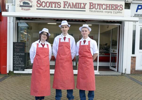 A new butchers has opened in Langold, Scott's Butchers. Butcher Scott Jopling, centre, with
Echo Jopling, left and Keane Barson